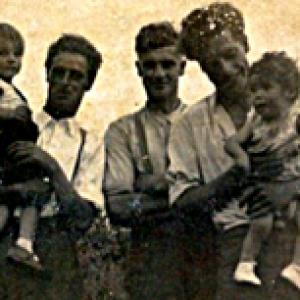 Eddie Stanley and Alfred Coe with children