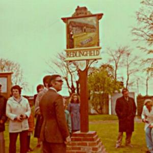 Unveiling village sign