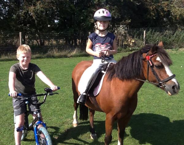 Tom Smith with Phoebe Smith and her 23 year old pony Lady